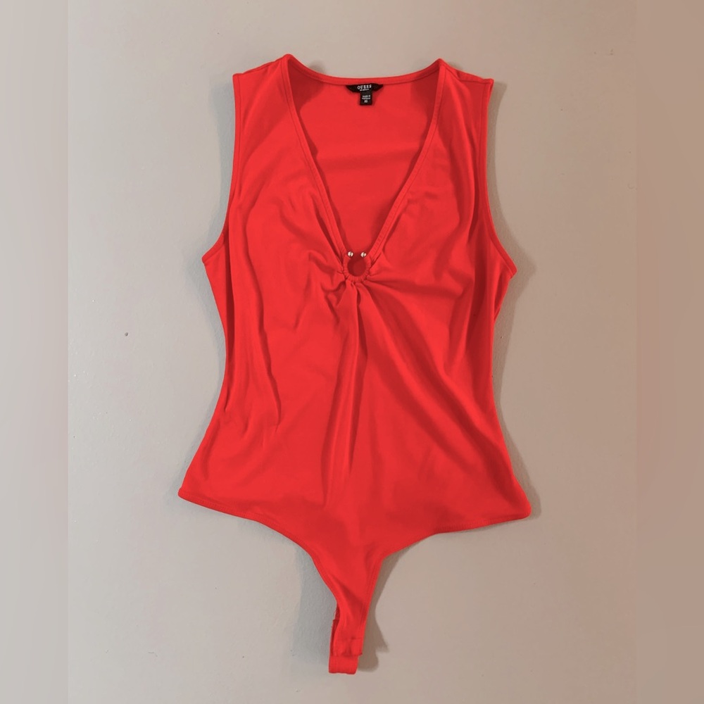 Orange bodysuit with silver ring